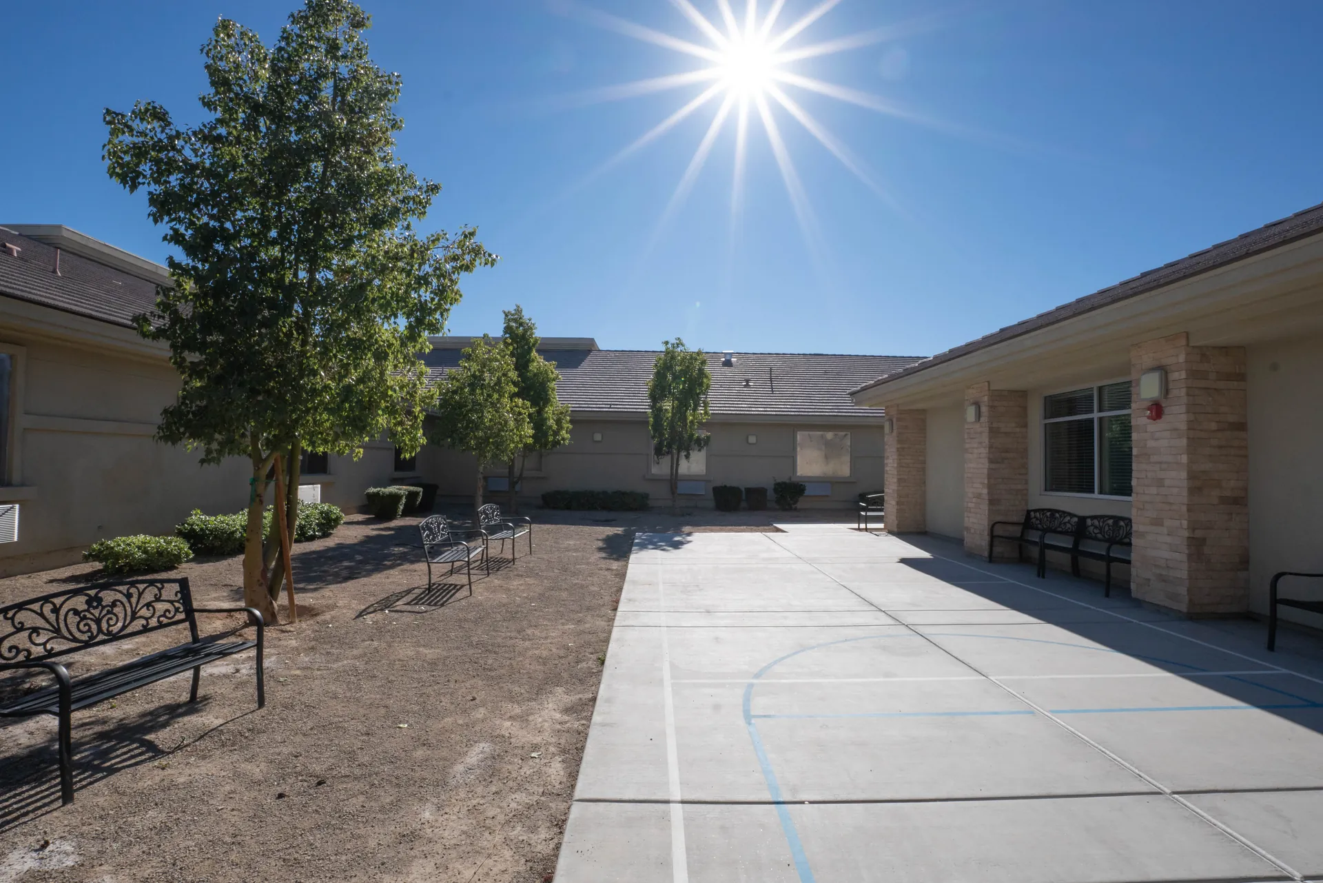 Outdoor courtyard with basketball court for recreation
