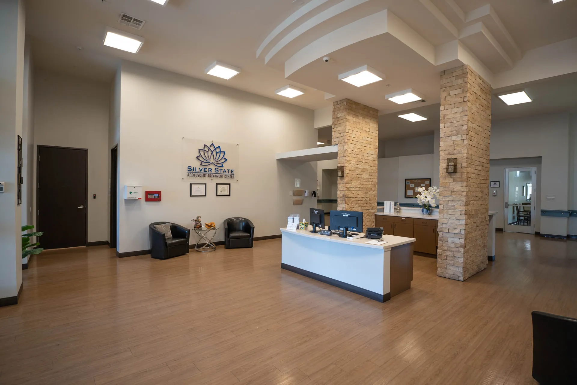 Main lobby and reception area with branded sign